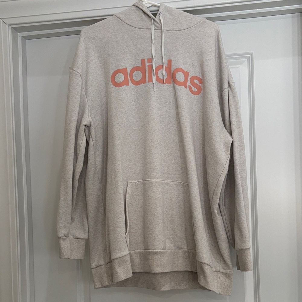 Adidas Women’s Oversized Off- White Hoodie with Bold Coral Logo